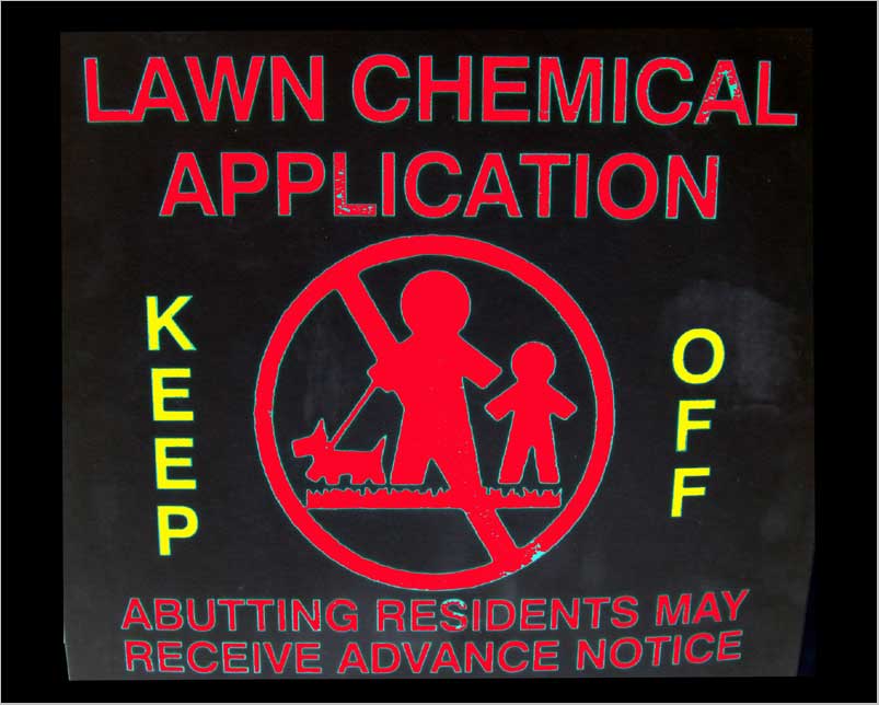 SIGN OF THE TIMES—America's symphony of toxins behind the carpet-like green lawns of suburbia